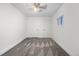 Bright bedroom with modern gray carpet, two closets, and an updated ceiling fan at 2601 W Amherst Ave, Denver, CO 80236