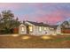 Charming single-story home featuring a cozy front porch, a well-maintained yard, and fresh exterior paint at 2601 W Amherst Ave, Denver, CO 80236