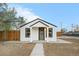 Charming single-story home featuring a cozy front porch, a well-maintained yard, and fresh exterior paint at 2601 W Amherst Ave, Denver, CO 80236