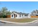 Charming home featuring a classic facade, fresh landscaping, and a quaint front yard at 2601 W Amherst Ave, Denver, CO 80236