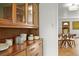 Dining room area with a vintage cabinet and hardwood flooring at 2445 Vance St, Lakewood, CO 80214