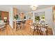 Stylish kitchen featuring a breakfast bar and an open layout with a dining area at 2445 Vance St, Lakewood, CO 80214