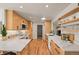 Modern kitchen with sleek cabinets, white countertops, stainless steel appliances, and open shelving at 2445 Vance St, Lakewood, CO 80214