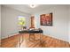 Well-lit office space with hardwood flooring, a modern desk, and serene views at 2445 Vance St, Lakewood, CO 80214