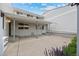 View of backyard with covered patio perfect for outdoor enjoyment at 7483 W Cedar Cir, Lakewood, CO 80226