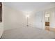 Carpeted bedroom with natural light and easy access to an adjacent bathroom at 7483 W Cedar Cir, Lakewood, CO 80226