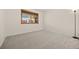Comfortable bedroom featuring neutral carpet and ample natural light, providing a blank canvas at 7483 W Cedar Cir, Lakewood, CO 80226