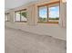 Bright bedroom featuring multiple large windows with views at 7483 W Cedar Cir, Lakewood, CO 80226