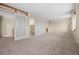 Open room features an accessible closet and a hallway at 7483 W Cedar Cir, Lakewood, CO 80226
