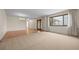 Spacious dining room with sliding glass doors, offering plenty of natural light and backyard views at 7483 W Cedar Cir, Lakewood, CO 80226