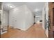 Spacious hallway leads to a living room with fireplace at 7483 W Cedar Cir, Lakewood, CO 80226