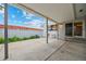 Covered patio area ideal for outdoor dining and relaxation with views of the backyard at 7483 W Cedar Cir, Lakewood, CO 80226