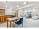Finished basement with bar area, table, living area, and neutral carpet at 138 S Holman Way, Golden, CO 80401