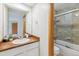 Bright bathroom features a white vanity and a shower with a glass door at 138 S Holman Way, Golden, CO 80401