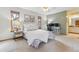 Cozy bedroom features a large window, workspace and ensuite bathroom at 138 S Holman Way, Golden, CO 80401