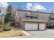 Exterior elevation showing the two-story condo with attached two-car garage at 138 S Holman Way, Golden, CO 80401
