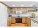 Bright kitchen with ample counter space and stainless steel appliances at 138 S Holman Way, Golden, CO 80401