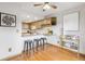 Cozy kitchen with barstool seating and modern appliances at 138 S Holman Way, Golden, CO 80401