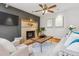 Inviting living room with a cozy fireplace, stylish decor, and a comfortable seating area at 138 S Holman Way, Golden, CO 80401