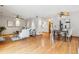 Open-concept living and dining area featuring hardwood floors and neutral décor at 138 S Holman Way, Golden, CO 80401