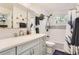 Well-lit bathroom with modern fixtures, subway tile shower, and a minimalist design for everyday convenience at 11848 Begole Cir, Golden, CO 80403