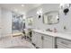 Beautiful bathroom with modern vanity, glass shower, and contemporary lighting at 11848 Begole Cir, Golden, CO 80403