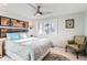 Comfortable bedroom with large window, ceiling fan, and stylish decor, creating a relaxing retreat at 11848 Begole Cir, Golden, CO 80403