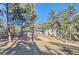 Beautiful home nestled among tall trees, showcasing a peaceful and private setting on a large lot at 11848 Begole Cir, Golden, CO 80403