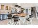 Bright, modern kitchen with central island and seating, perfect for casual dining at 11848 Begole Cir, Golden, CO 80403