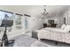 This spacious main bedroom features a large TV, seating area, and exercise bike at 11848 Begole Cir, Golden, CO 80403