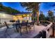 Outdoor dining area features a rustic wooden fence and string lights for ambiance at 11848 Begole Cir, Golden, CO 80403