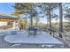 Outdoor patio featuring a dining table, chairs, and a scenic view of the forest and nearby mountains at 11848 Begole Cir, Golden, CO 80403