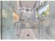 Sleek shower featuring marble walls, accent lighting, and a modern shower-head for a spa-like experience at 11848 Begole Cir, Golden, CO 80403