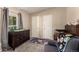 Cozy Bedroom features a changing table, crib, and soft gray carpet at 6105 Needlegrass # 307, Frederick, CO 80530