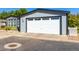Home with attached two car garage and well manicured lawn at 6105 Needlegrass # 307, Frederick, CO 80530
