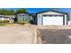 Front exterior of home with an attached two car garage at 6105 Needlegrass # 307, Frederick, CO 80530