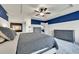 Bedroom features a tray ceiling, ceiling fan, fireplace, ensuite bath, and dual dressers at 15767 E 109Th Ave, Commerce City, CO 80022