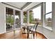 Eating area with large windows overlooking the backyard and sliding door to patio at 15767 E 109Th Ave, Commerce City, CO 80022