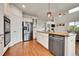 Kitchen with stainless steel refrigerator and appliances; hardwood floors plus eat in space and Gathering room at 15767 E 109Th Ave, Commerce City, CO 80022