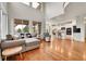 Spacious living room with soaring ceilings, lots of natural light, and open kitchen concept at 15767 E 109Th Ave, Commerce City, CO 80022