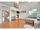 Bright living room boasts a fireplace, tall ceilings, and an open floor plan at 15767 E 109Th Ave, Commerce City, CO 80022