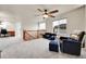 Loft area with desk and carpet, ceiling fan, and windows at 15767 E 109Th Ave, Commerce City, CO 80022