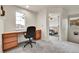 Office with built-in desk, carpet, and window with a view at 15767 E 109Th Ave, Commerce City, CO 80022