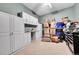 Storage room with built-in cabinets, a work desk, and abundant space for organizing and storing belongings at 15767 E 109Th Ave, Commerce City, CO 80022