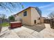 Backyard patio with a hot tub, concrete patio and access to the house at 12432 Bellaire St, Thornton, CO 80241