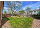 Spacious backyard featuring well-maintained grass and wood fence at 12432 Bellaire St, Thornton, CO 80241
