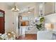 Inviting entryway with view into the kitchen and staircase at 12432 Bellaire St, Thornton, CO 80241