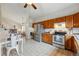 Spacious kitchen with stainless steel appliances and open layout at 12432 Bellaire St, Thornton, CO 80241