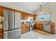 Well-maintained kitchen featuring stainless appliances and a bright window at 12432 Bellaire St, Thornton, CO 80241