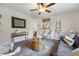 Comfortable living room with stylish decor, a cozy sofa, and a view into the dining area at 12432 Bellaire St, Thornton, CO 80241